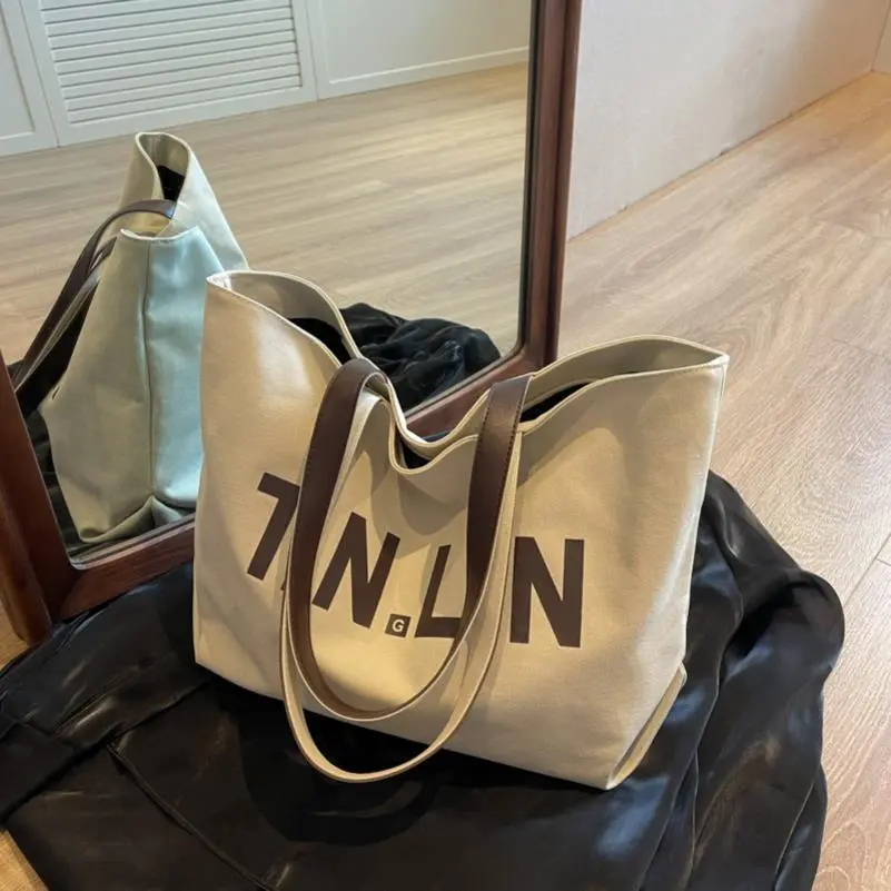 休闲大容量帆布包包女2025新款潮时尚单