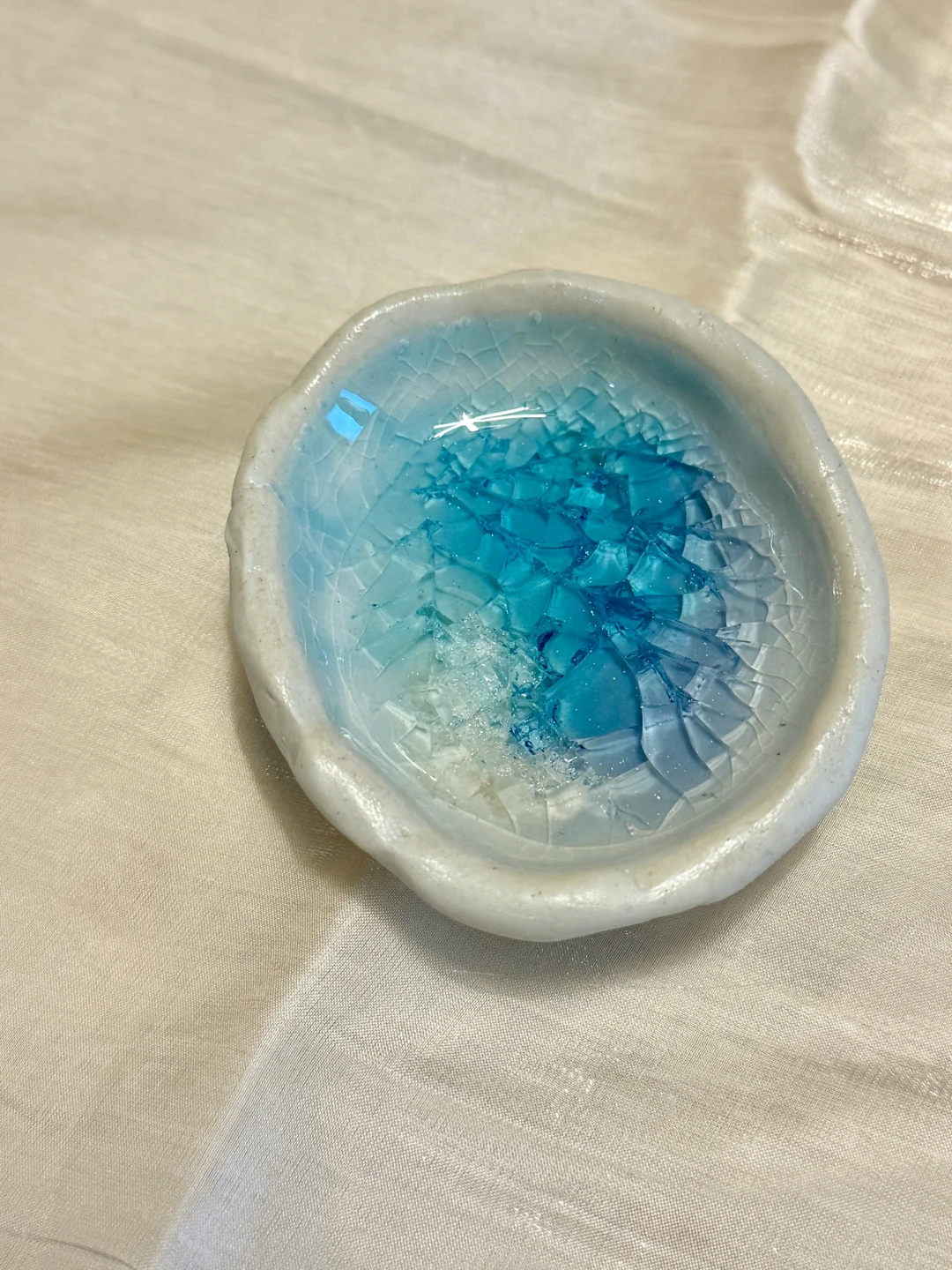 来看看玻璃放进陶瓷里烧前和烧后