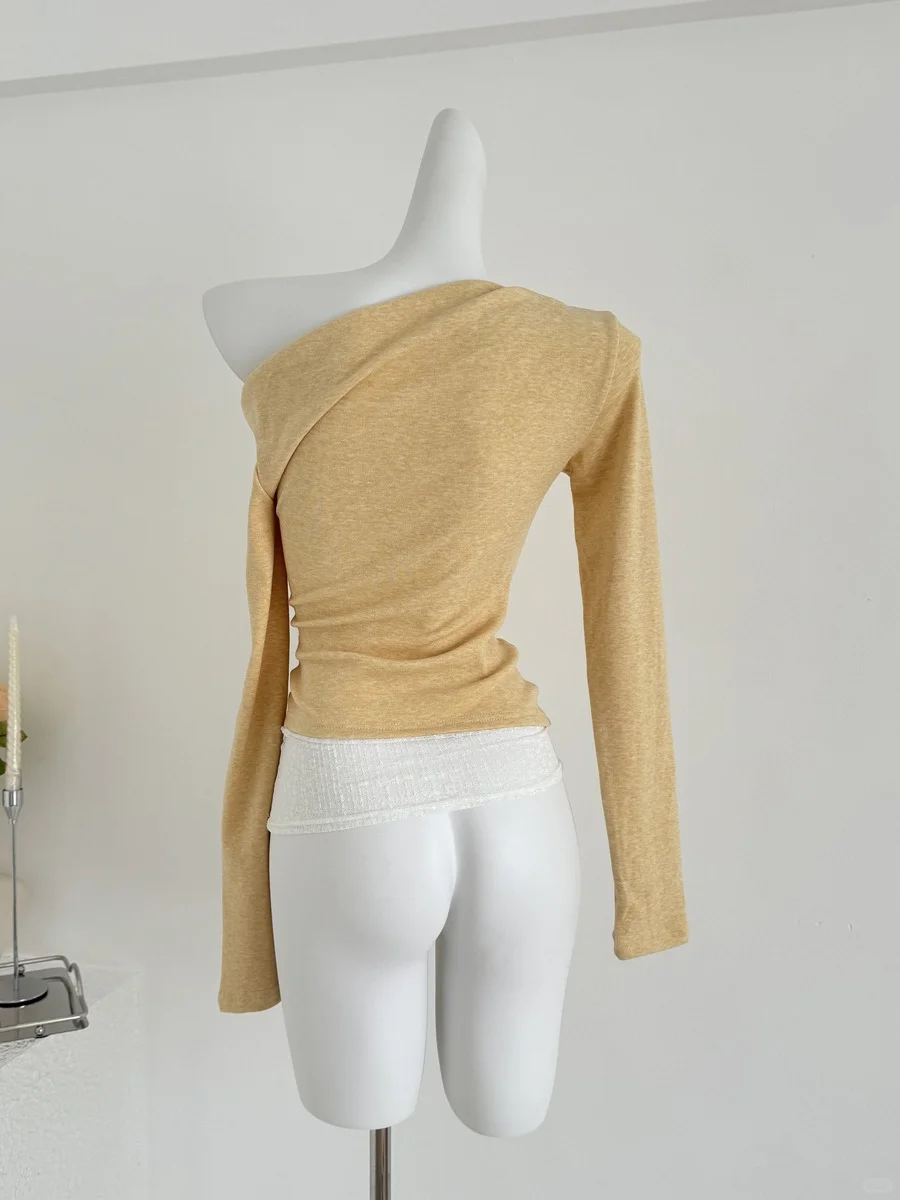 75?蕾丝拼接不对称上衣