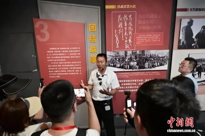 中新网丨一首歌曲传唱80余载 “团结村”以红带绿成旅游打卡地