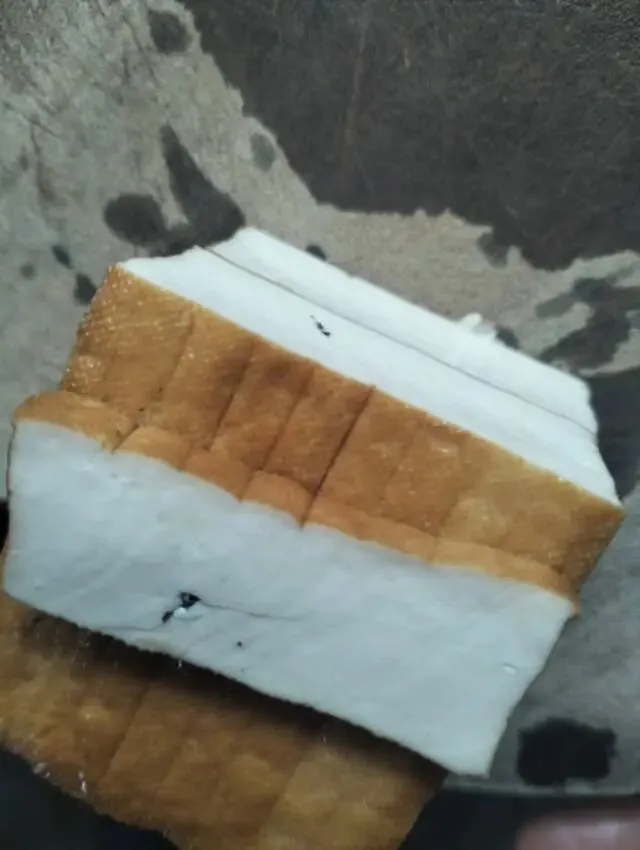 一块带杂质的香干子,戳破的是市场与良心的底线