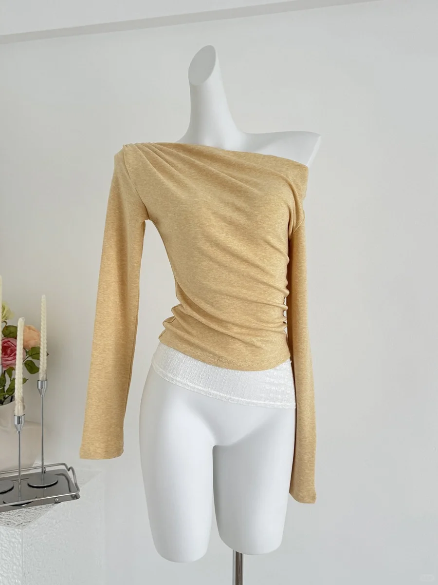 75?蕾丝拼接不对称上衣