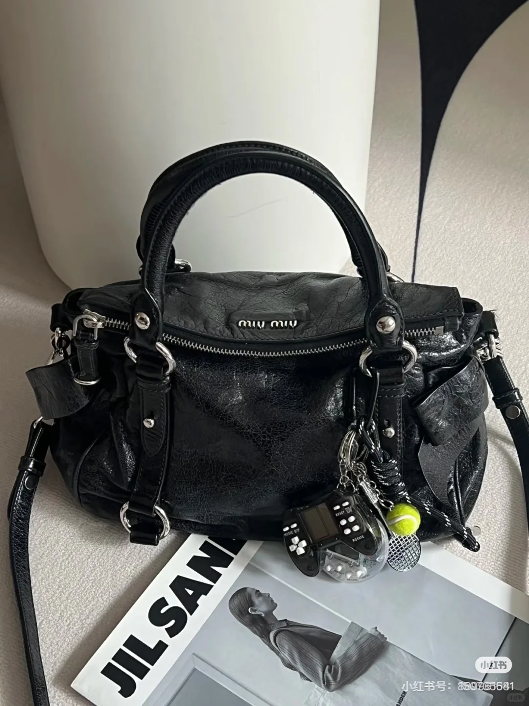 求购miumiu机车包黑银